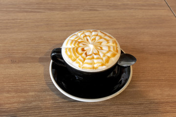 Hot coffee on wooden table