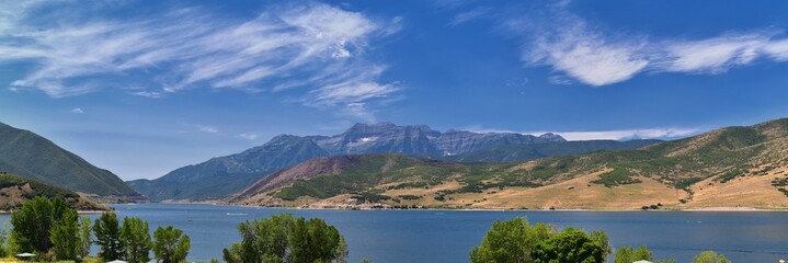Fototapeta na wymiar Panoramic Landscape view from Heber, Utah County, view of backside of Mount Timpanogos near Deer Creek Reservoir in the Wasatch Front Rocky Mountains, and Cloudscape. Utah, USA.