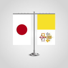 Table stand with flags of Japan and Vatican.Two flag. Flag pole. Symbolizing the cooperation between the two countries. Table flags