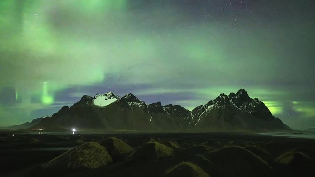 Iceland night landscape amazing northern light in vestrahorn mountain with black sand dunes at stokksnes (Move Down-Up)