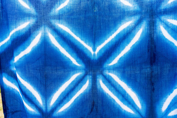 Tie batik dyeing tie batik indigo color or mauhom color on fabric background