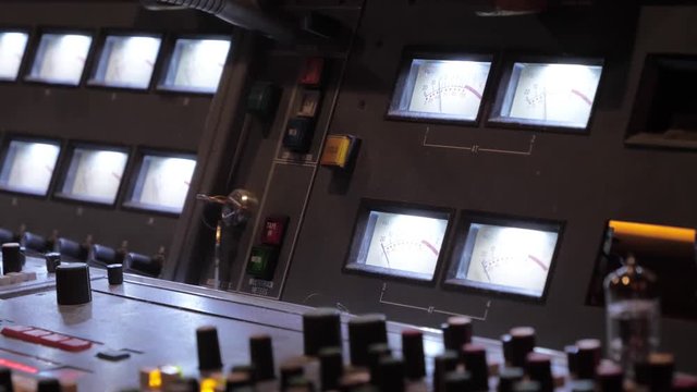 Audio engineer music industry recording studio mixing desk using faders
