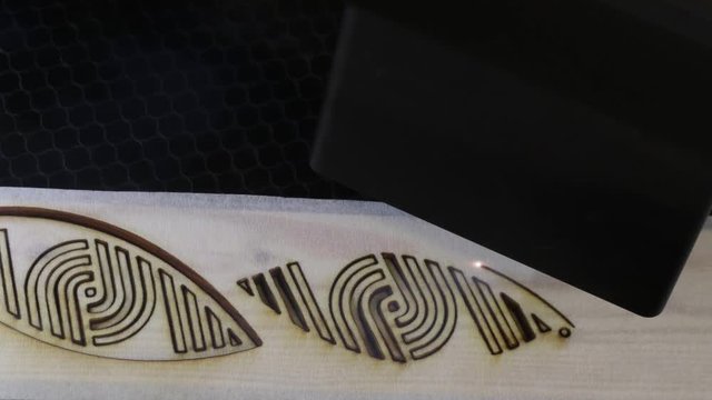 Laser cutting wood , still shot.