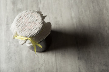 top view of jar covered with tissue and ribbon