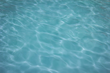 Fototapeta na wymiar swimming pool with sunny reflections background