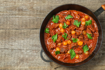 A traditional Greek dish of beef stifado in a sauce. The view from the top. Copy-space