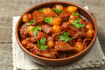 A traditional Greek dish of beef stifado in a sauce. The view from the top. Copy-space