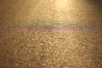 The asphalt at sunset. Orange asphalt