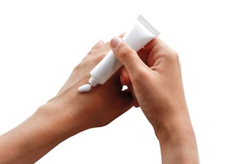Hand puts the cream on the second hand. White hand cream in a white tube. Isolated on white background. Close up