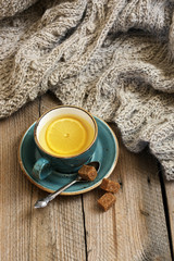 Still life with tea and knitwear