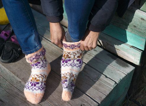  Woman Putting Wool Socks On