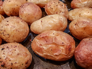 Close up of potatoes baked in skin.