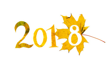 2018. figures carved from yellow maple leaves