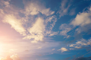 Naklejka na ściany i meble Evening sun with sky with clouds For background
