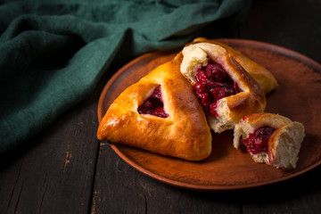 Broken pie with cherries
