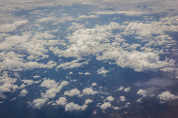 Obraz na płótnie Canvas Blue sky with clouds background on the airplan