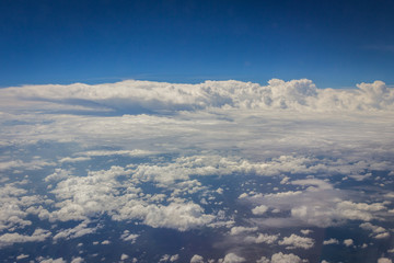 Fototapeta na wymiar Blue sky with clouds background on the airplan