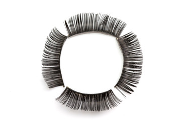 Used Black false eyelash isolated on white Arranged in a circle
