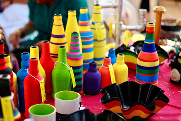 colorful plastic bottles on a table at flea market