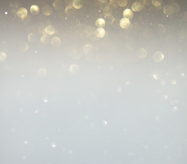 Obraz premium glitter vintage lights background. silver, gold and white. de-focused.