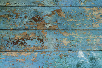 Texture of a wooden wall with blue paint. Can be used as a backg