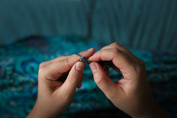 Knitting on knitting needles close-up, creativity