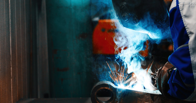 Metal cutting with acetylene torch in industry