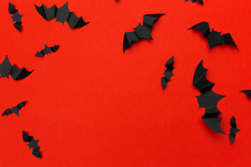 halloween and decoration concept - paper bats flying