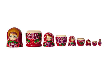 Fototapeta premium Souvenir of the Russian doll Nesting dolls bright red on white background isolated closeup
