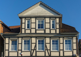 Fototapeta na wymiar old timber framed house with blue sky background