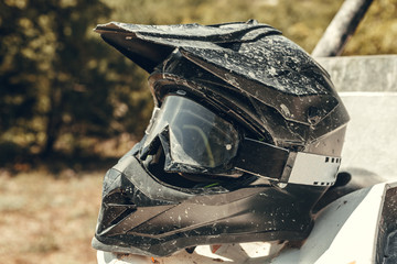 Dirty motorcycle motocross helmet with goggles