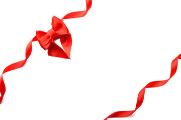 Red ribbons with beautiful bow on white background