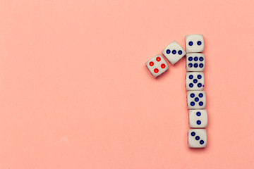 Number one  lay out of dice on peachy background close up