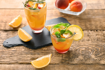 Fresh summer cocktail in glasses on wooden table