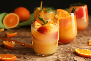 Fresh summer cocktail in glasses on wooden table