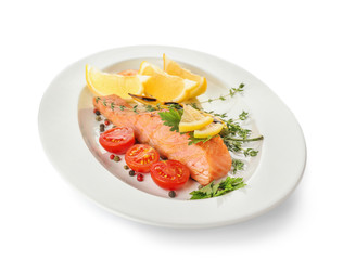 Plate with tasty salmon on white background