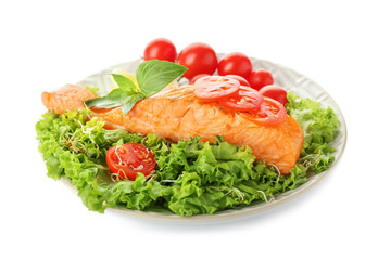 Plate with tasty salmon and fresh salad on white background