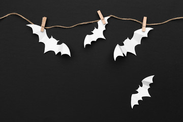 halloween and decoration concept - paper bats flying