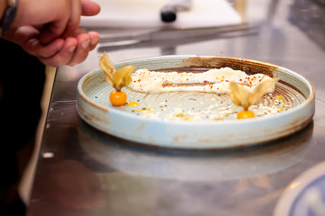 Chef in restaurant does fine dining. Delicious food preparation