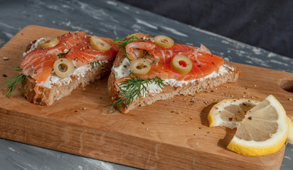 Sandwiches with trout and olives