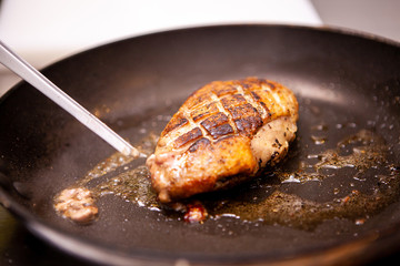 Delicious duck breast cooked in pan. Making delicious meal