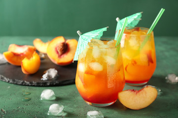 Fresh summer cocktail in glasses on color table