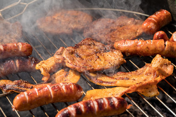 Unhealthy but tasty grilled sausages and meat
