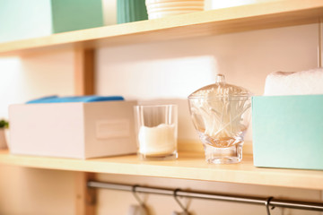 Body care accessories on shelf in bathroom