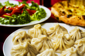 A dish of khinkali, a traditional georgian dumpling. Close-up photo