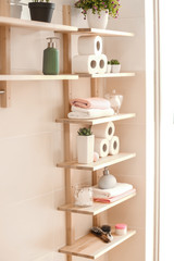 Bath accessories on wooden shelves