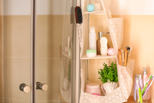 Body care accessories on shelves in bathroom
