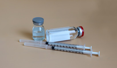 Small vials and disposable syringes.