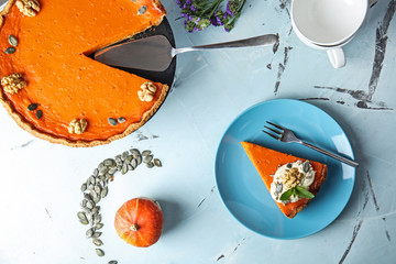 Flat lay composition with tasty pumpkin pie on table