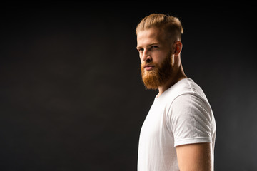 Handsome young guy posing in studio - isolated.